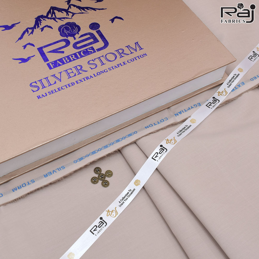 Raj Fabrics Silver Storm fabric with packaging and buttons on a beige background
